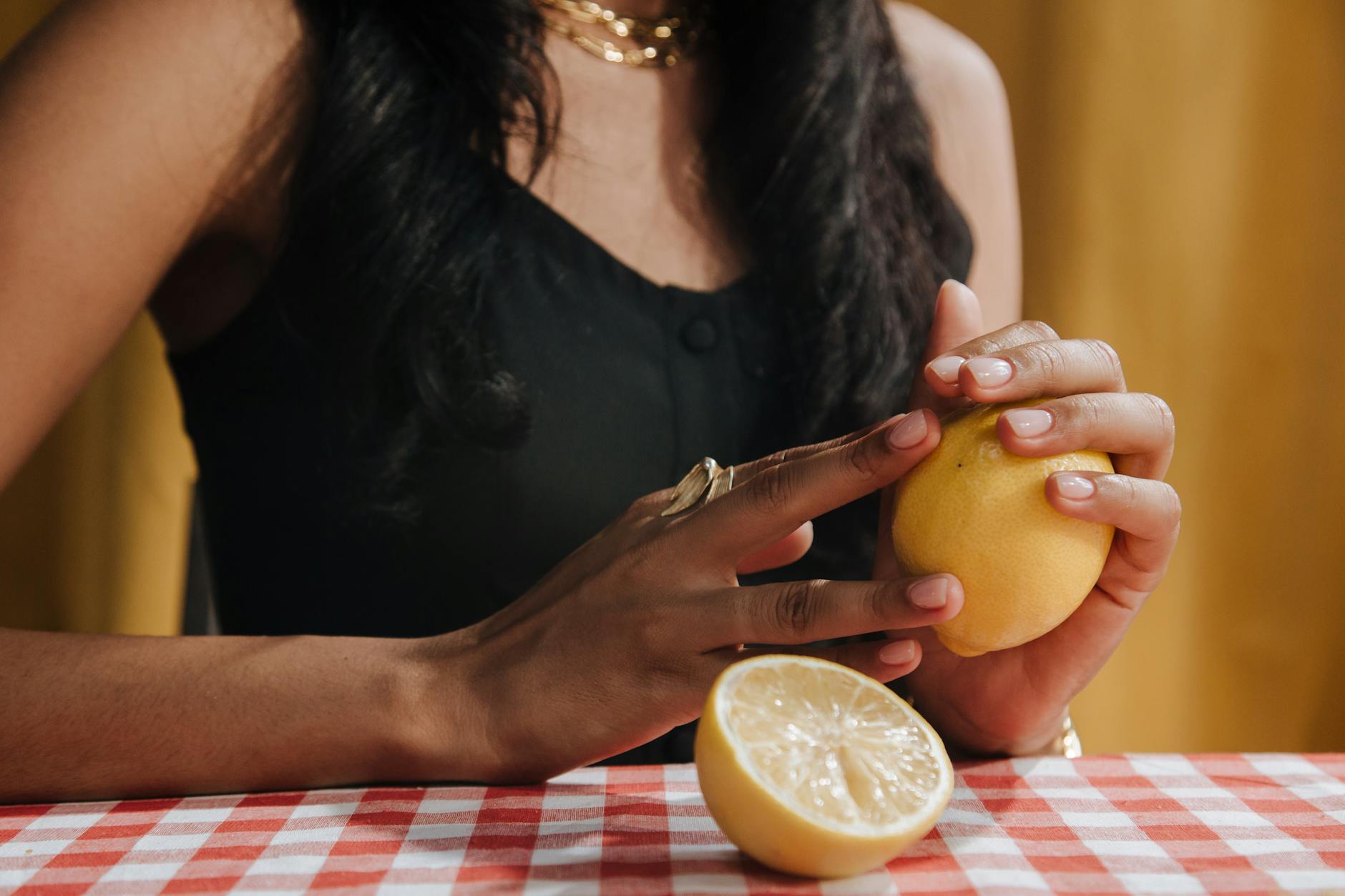 Two hands holding pink and blue silicone vibrators against a pastel background, representing couple connection