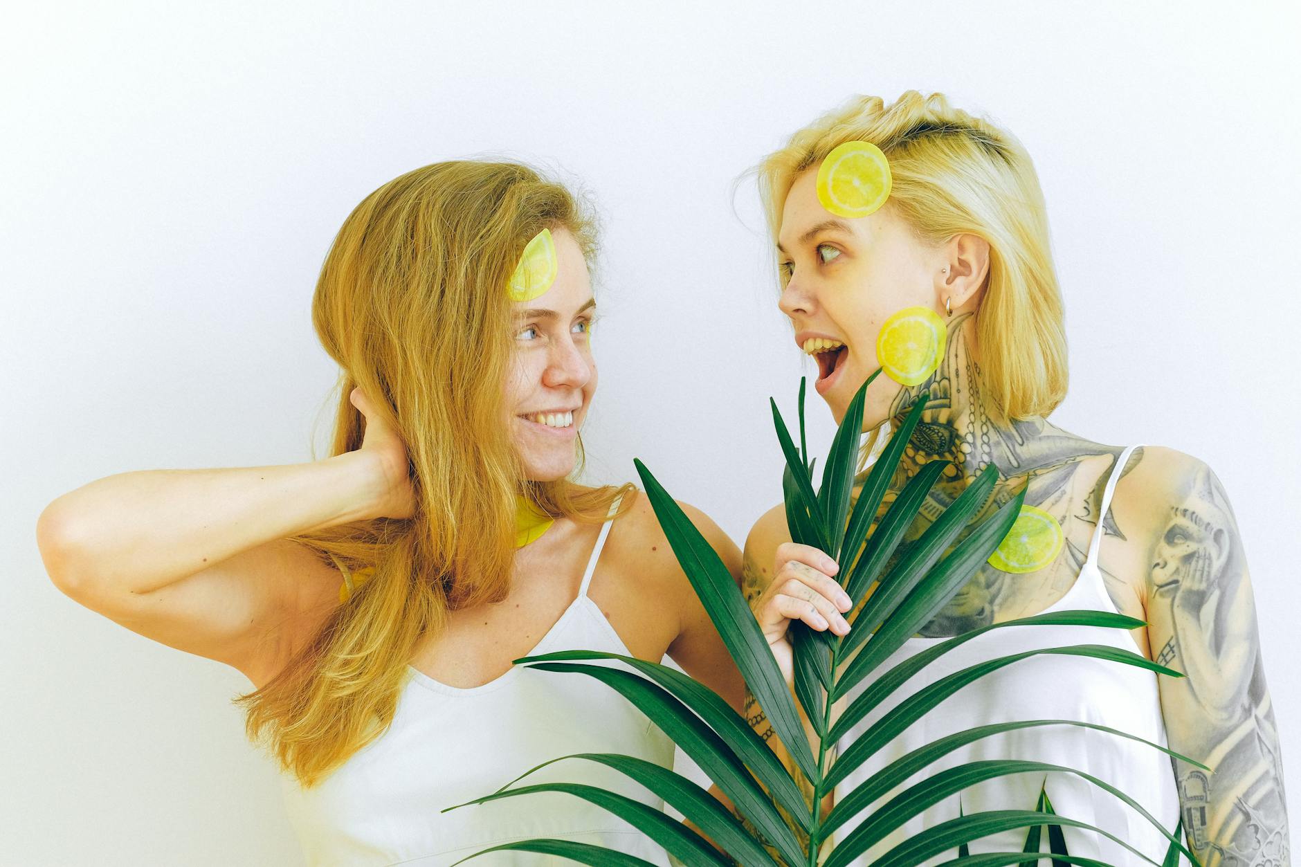 Woman holding clitoral vibrators with contemplative expression, reconnecting with self-pleasure